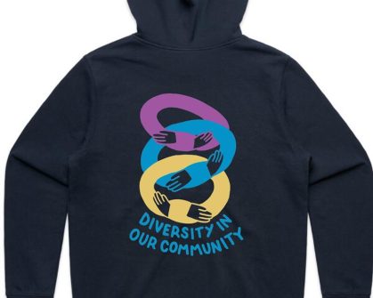 Blue hoodie with yellow, blue and purple interlocking hands. Blue text saying Diversity in our community.